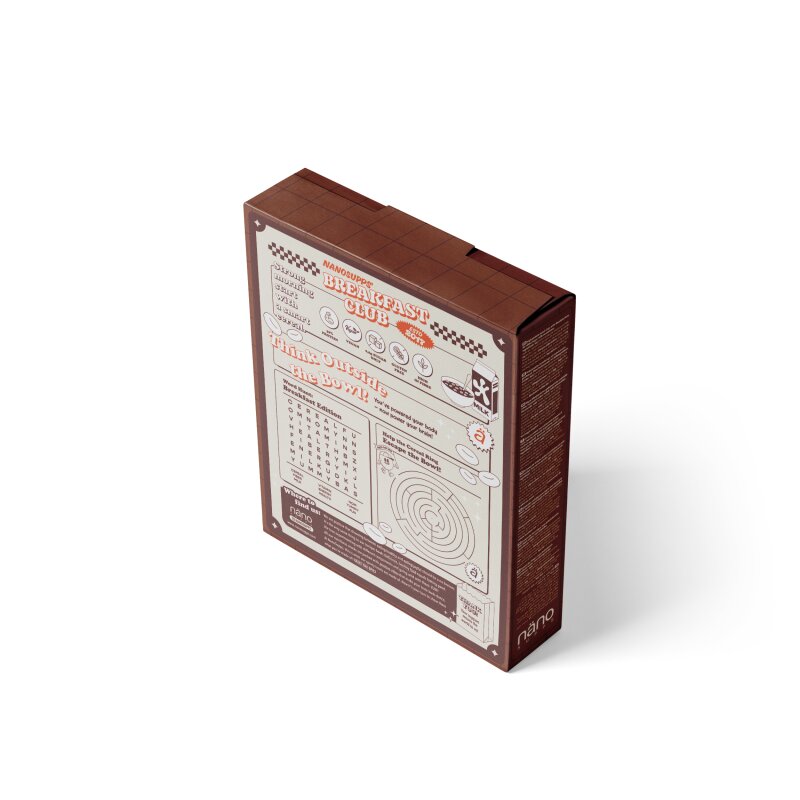 Nano Supps Protein Cereal 250g Choco, Rückseite der braunen Müslischachtel mit Rätseln und Texten.